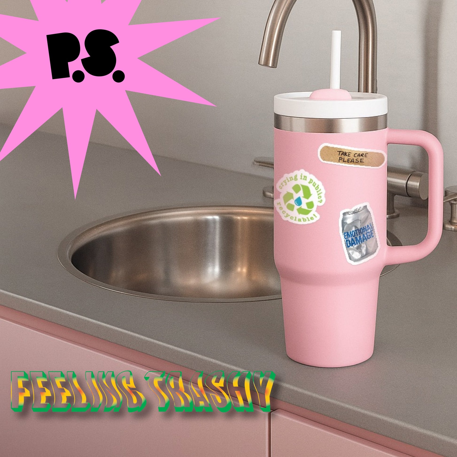 Pink tumbler with handle on a kitchen counter, featuring stickers and text.