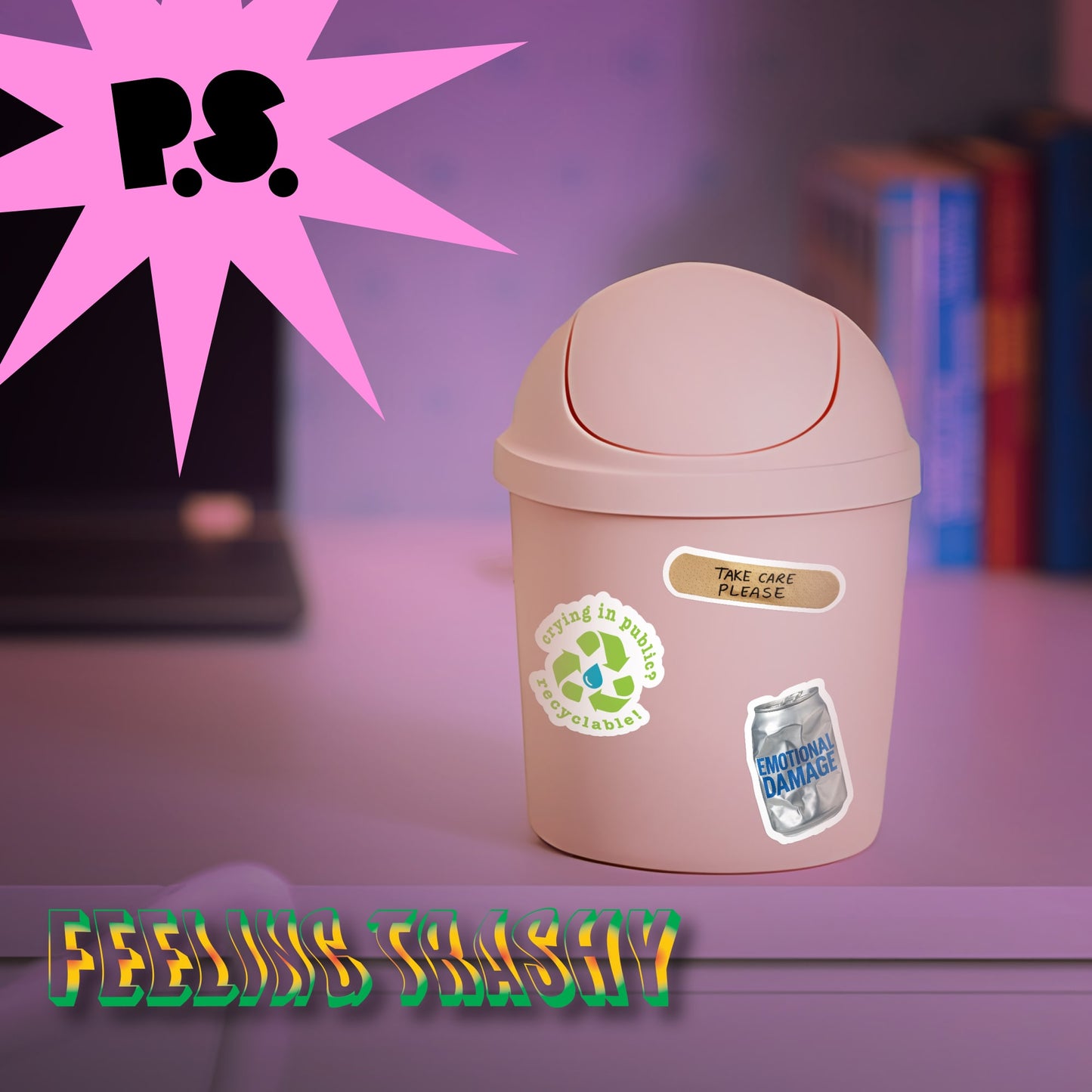 Pink trash bin with recycling labels on a blurred background