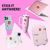 Collection of pink products with coffee cup stickers on a pink background