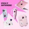 Collection of items with stickers on a pink background, including a phone, tumbler, laptop, suitcase, and pouch.